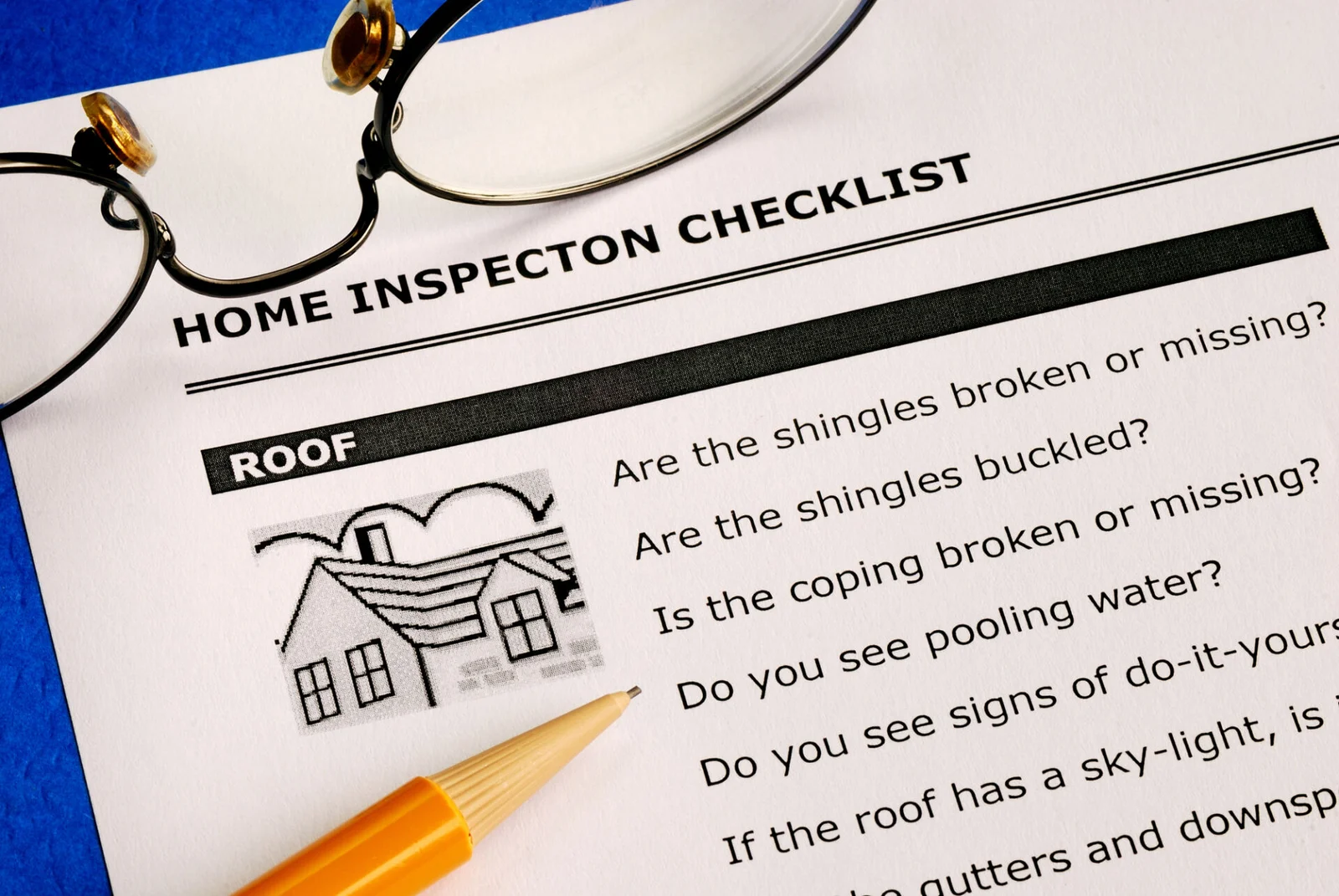Home inspection checklist document with pencil and glasses representing home inspector training at Inspection21 in New Jersey