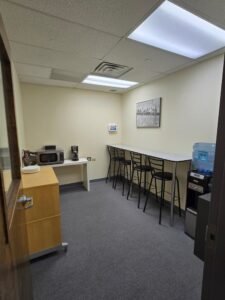 Student break area at Inspection21 Paramus NJ campus with seating, kitchenette, and workspace